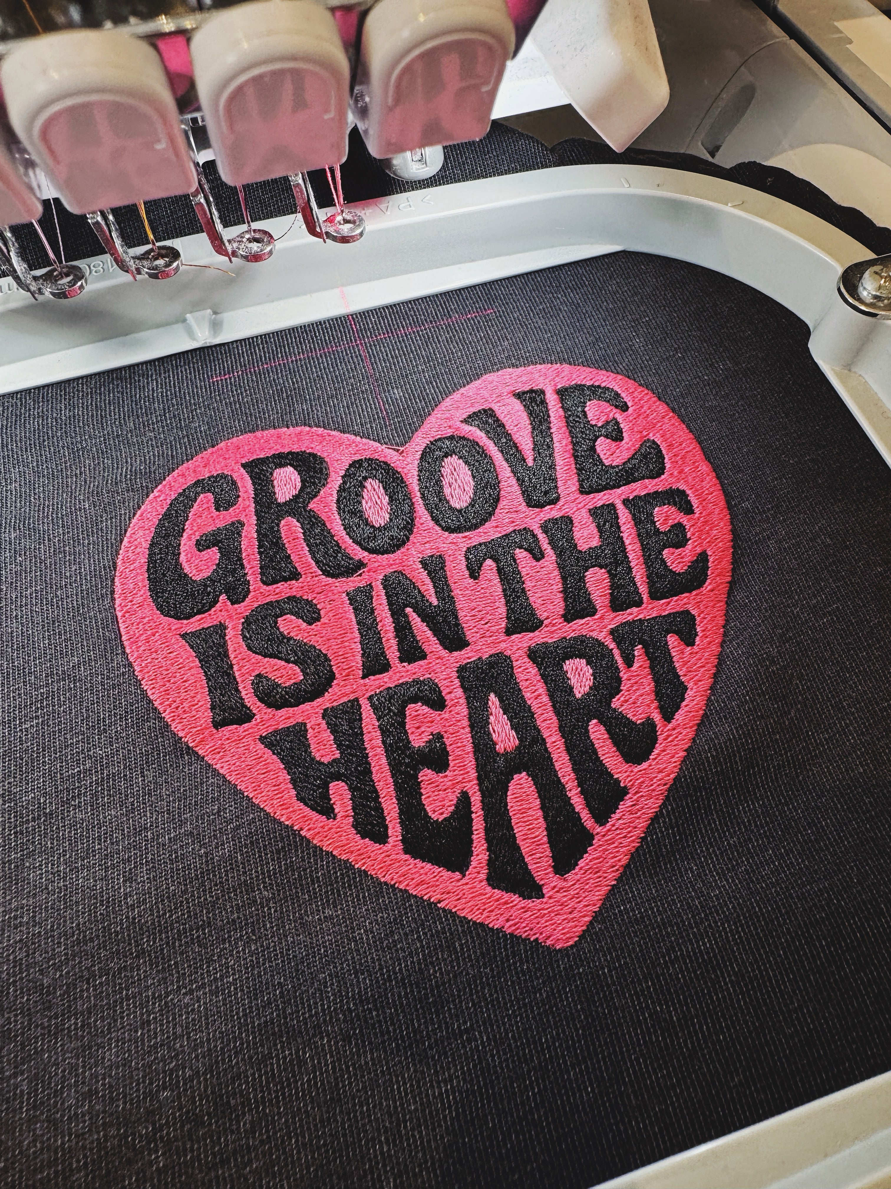 'GROOVE IS IN THE HEART' left chest embroidered premium organic unisex vintage aged t-shirt