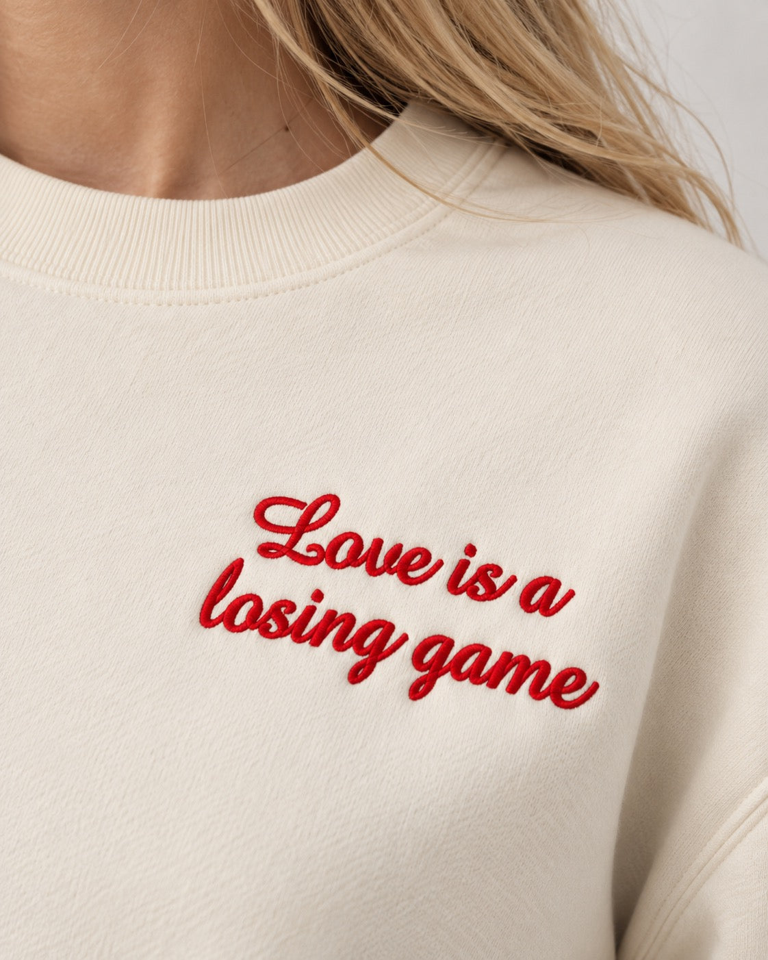 Women's 'LOVE IS A LOSING GAME' left chest embroidered premium organic women's drop shoulder 'Alma' sweatshirt