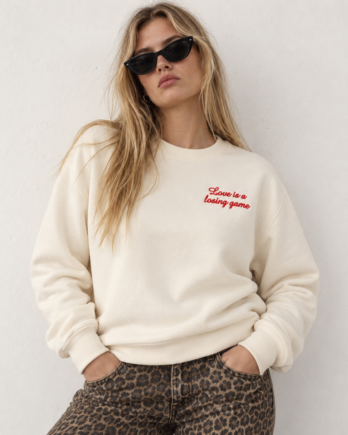 Women's 'LOVE IS A LOSING GAME' left chest embroidered premium organic women's drop shoulder 'Alma' sweatshirt