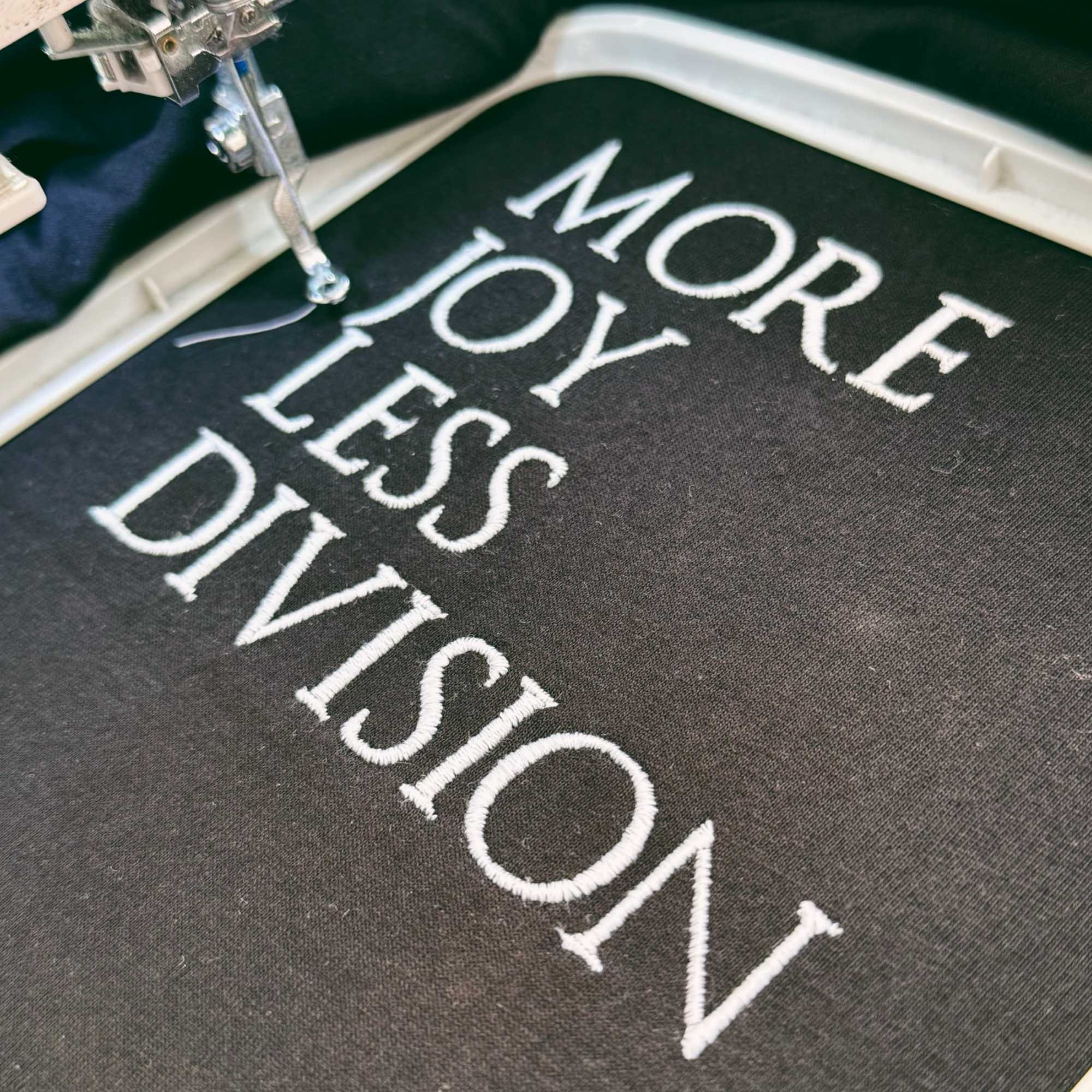 'MORE JOY LESS DIVISION' Left chest embroidered premium organic men's classic crew neck 'Rocker' t-shirt