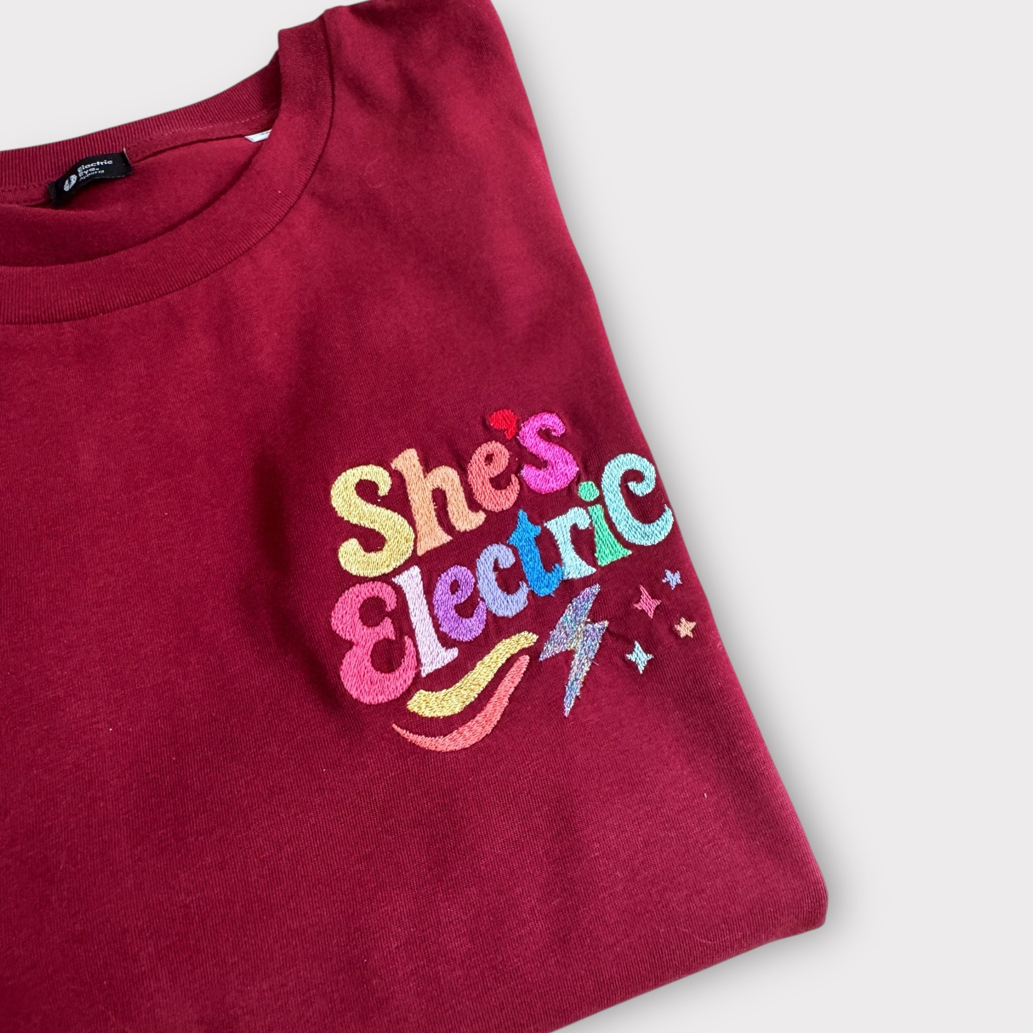Retro Rainbow 'SHE'S ELECTRIC' embroidered women's left chest premium organic medium fit 'Muser' t-shirt - inspired by Oasis