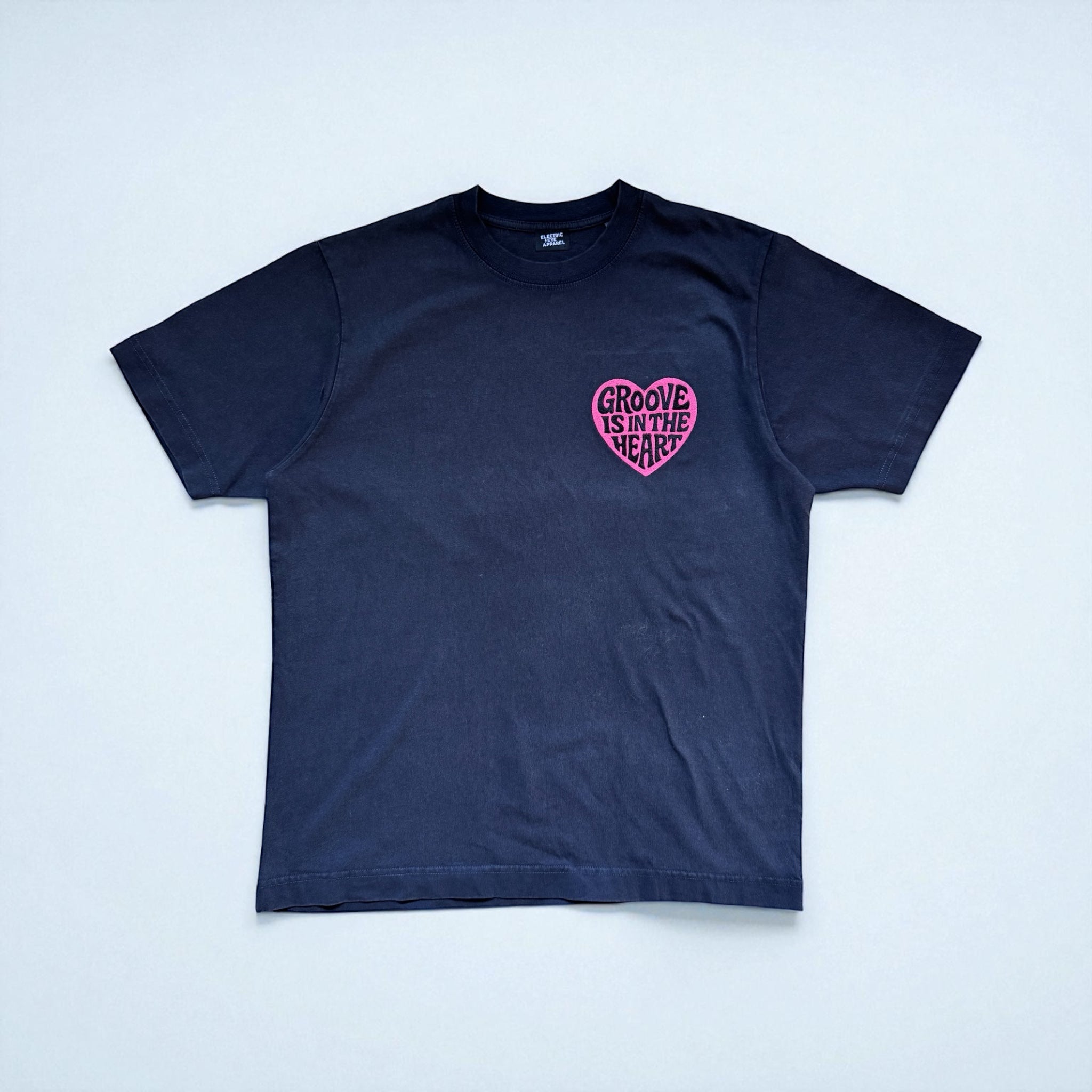 'GROOVE IS IN THE HEART' left chest embroidered premium organic unisex vintage aged t-shirt