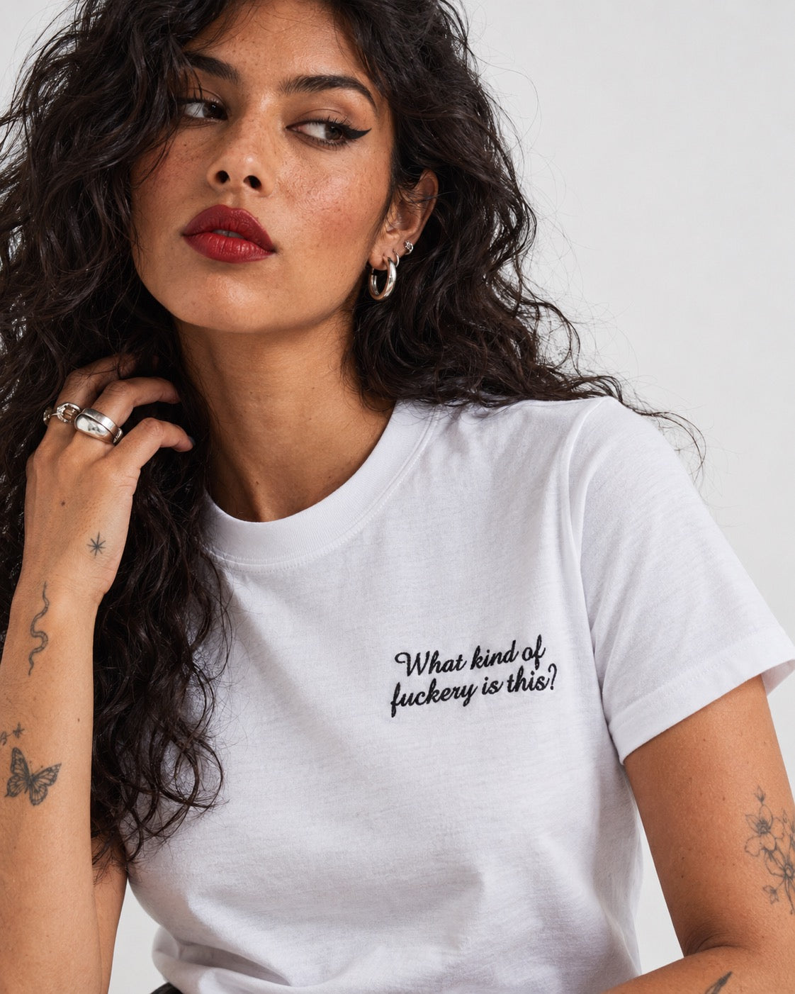 Women's 'WHAT KIND OF F CKERY IS THIS?' left chest embroidered premium organic medium fit 'Muser' t-shirt