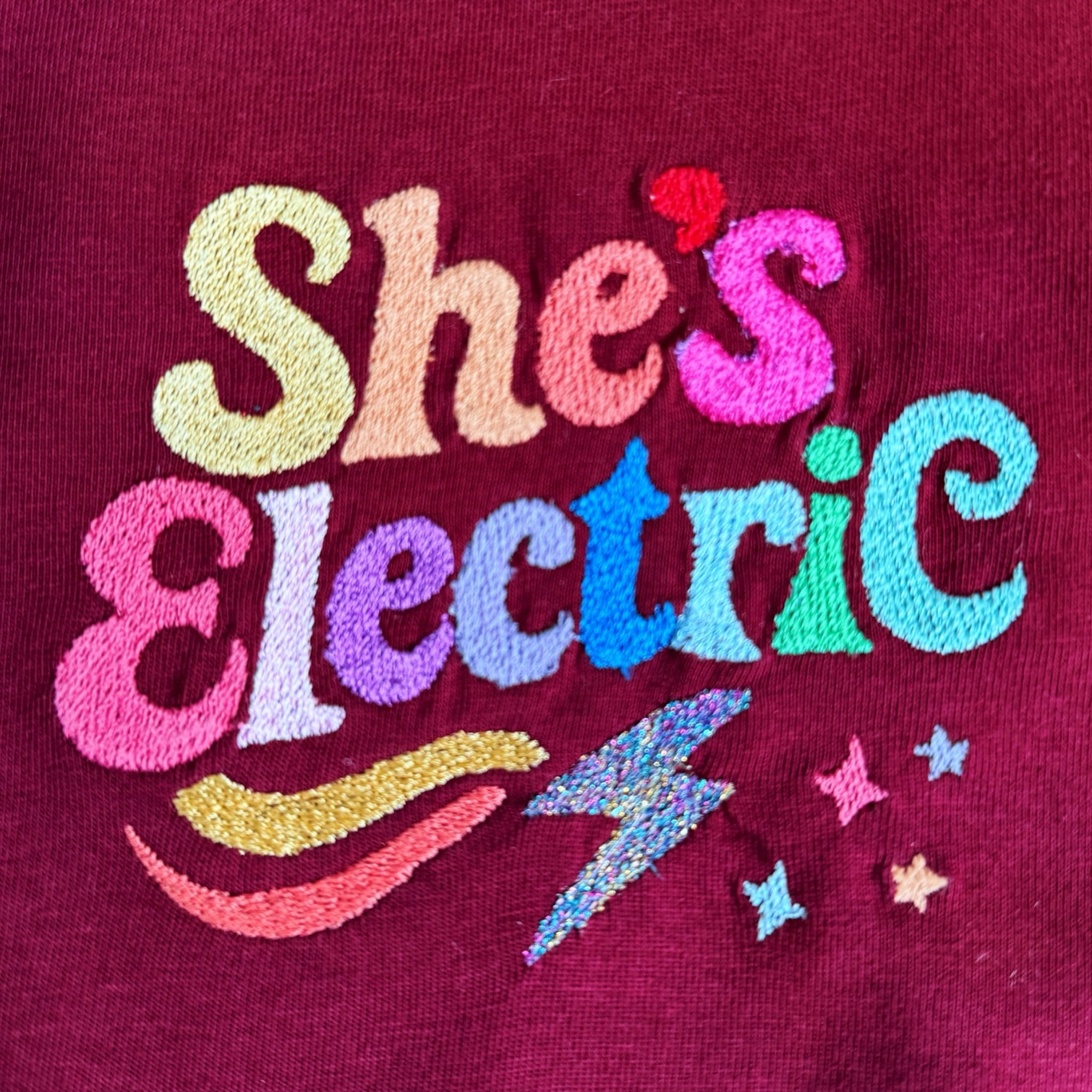 Retro Rainbow 'SHE'S ELECTRIC' embroidered women's left chest premium organic medium fit 'Muser' t-shirt - inspired by Oasis