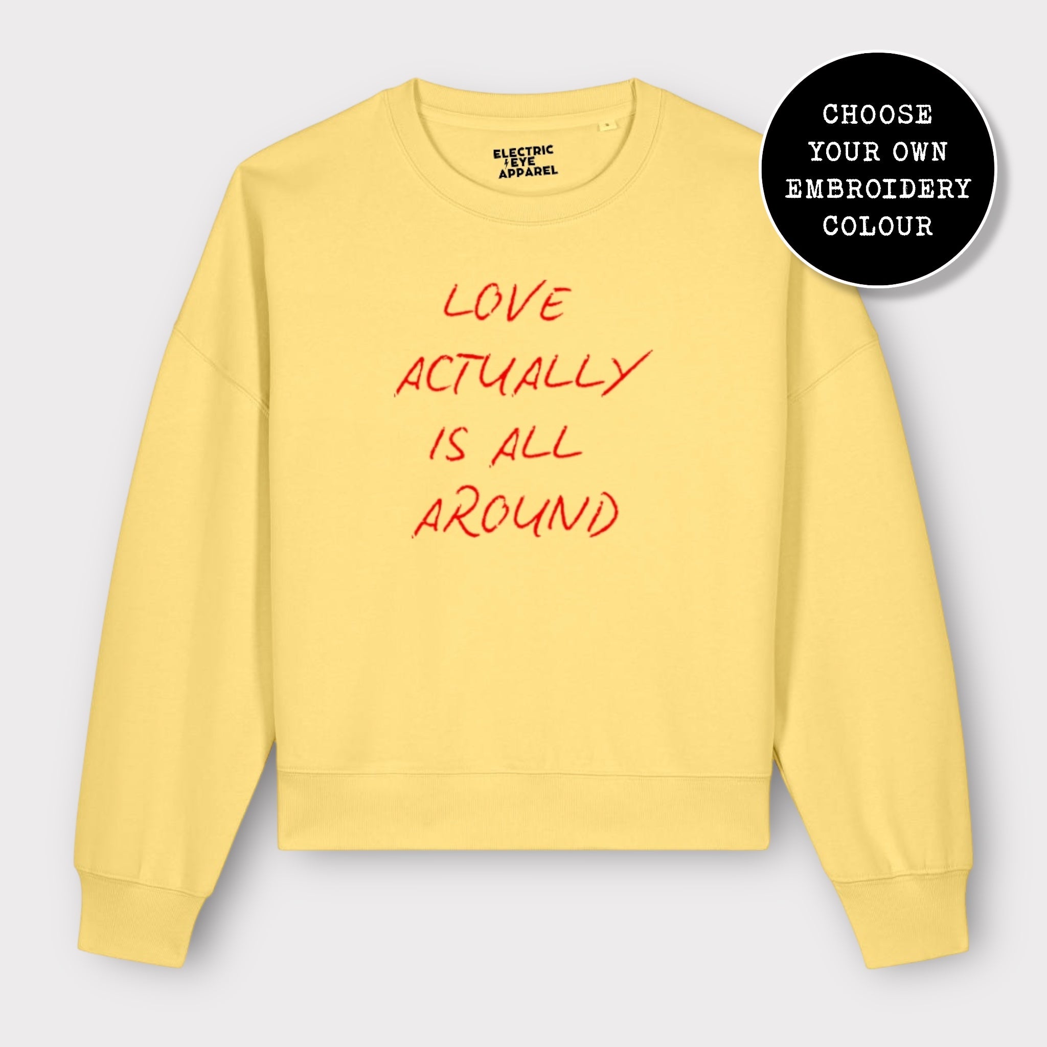 'LOVE ACTUALLY IS ALL AROUND' embroidered organic women's dropped shoulder 'alma' sweatshirt