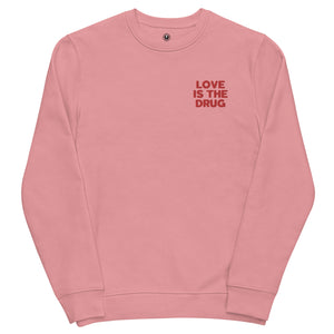 LOVE IS THE DRUG left chest embroidered unisex organic sweatshirt