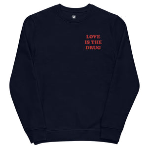 LOVE IS THE DRUG Left Chest Embroidered Unisex Organic sweatshirt