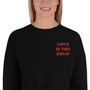 LOVE IS THE DRUG Left Chest Embroidered Women's Crop Sweatshirt