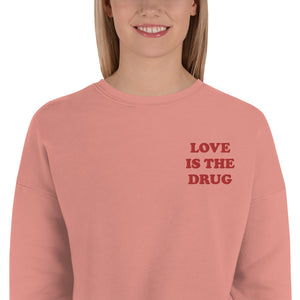 LOVE IS THE DRUG Left Chest Embroidered Women's Crop Sweatshirt