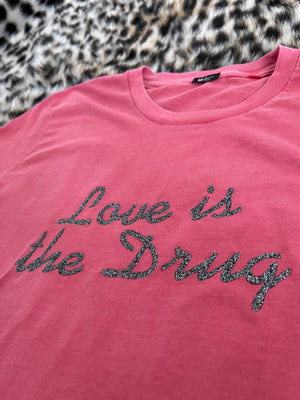 'LOVE IS THE DRUG' EMBROIDERED UNISEX GARMENT DYED ORGANIC COTTON T-SHIRT