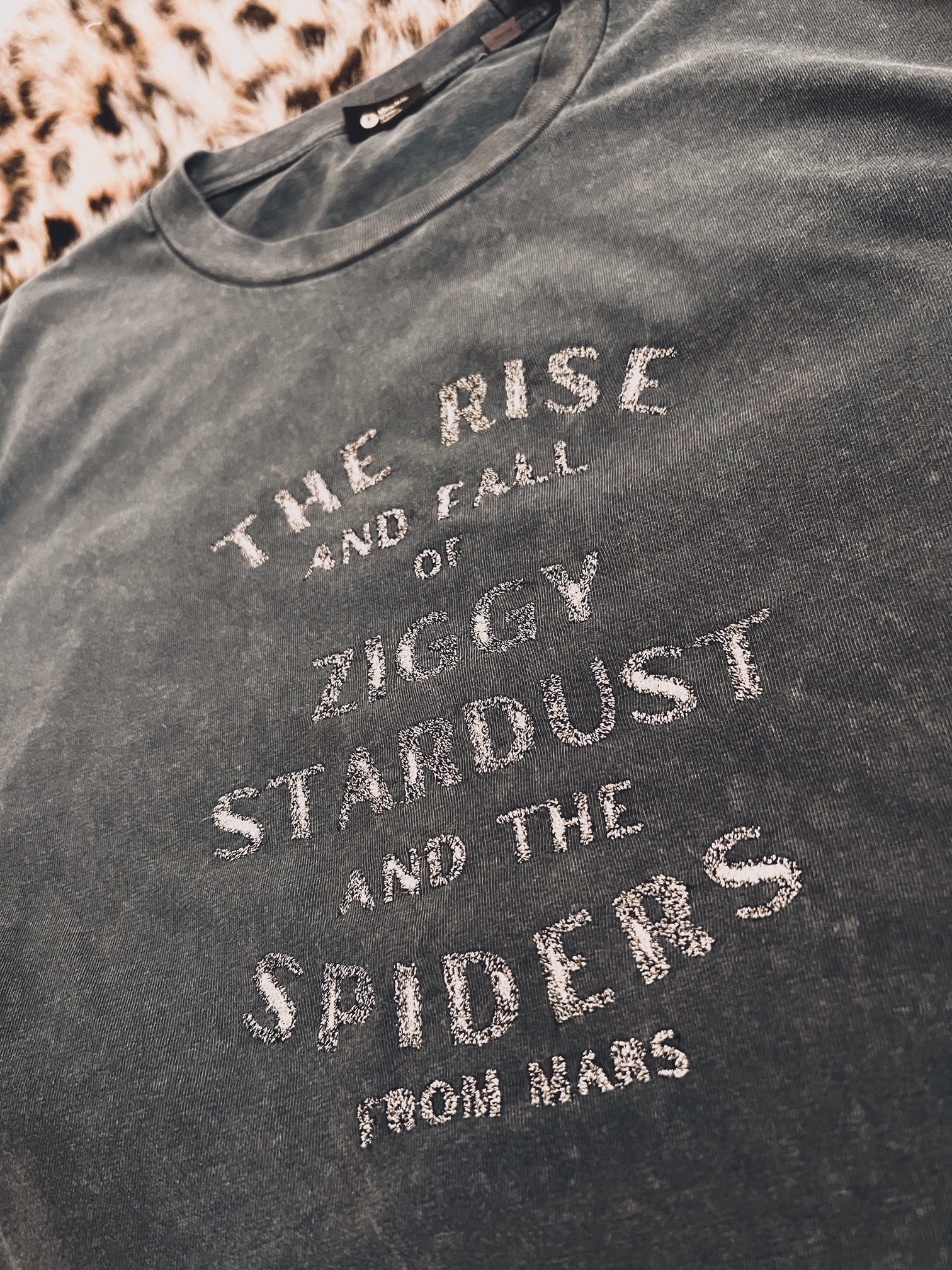 'THE RISE AND FALL OF ZIGGY STARDUST AND THE SPIDERS FROM MARS’ EMBROIDERED UNISEX VINTAGE GARMENT DYED ORGANIC COTTON T-SHIRT